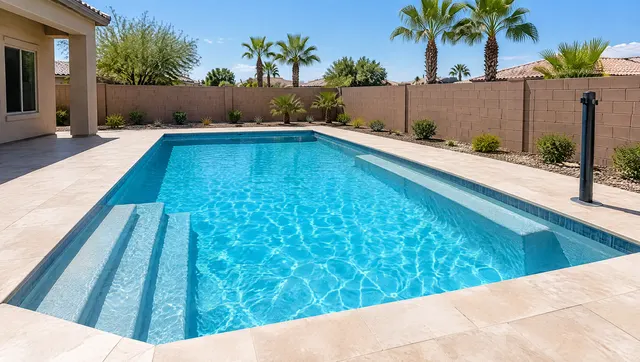 New play pool in a Mesa family backyard: even 3.5 to 5 foot depth with no deep end, wide entry steps, a long bench, bright blue water, deck space for a volleyball net post sleeve, block wall and palm trees beyond, sunny day, no people